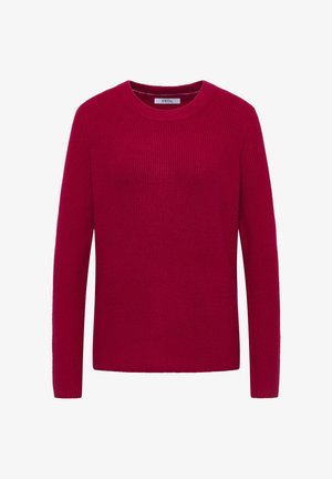 Punainen neulepaita, jossa on pyöreä kaula-auko, pitkät hihat ja ribbireunus. Kankaan vaikutelma on pehmeä ja lämmin minimalistisella suunnittelulla.