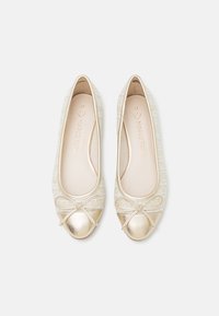 Beige ballet flats with a textured upper, rounded toe, and metallic gold accents. Features a decorative bow at the front. Size 37.