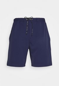 Námořnické modré plavky vyrobené z lehkého materiálu, s elastickým pasem a šňůrkou a dvěma postranními kapsami. Hladká textura.