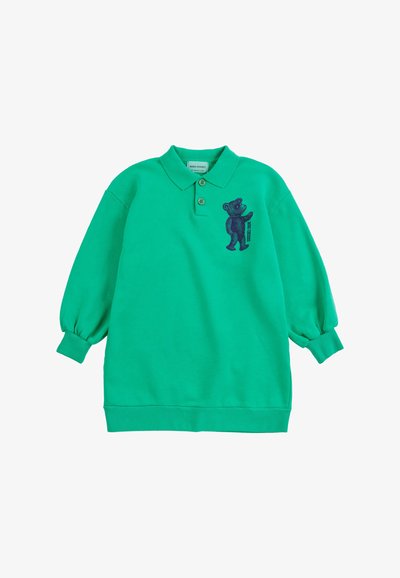 Polo vert à manches longues avec deux boutons et un petit motif ours marine sur la poitrine gauche.