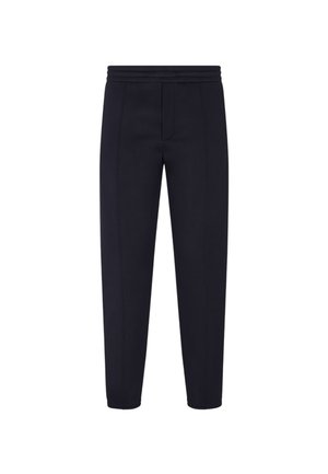 Pantaloni jogger tapered blu navy realizzati in un tessuto morbido, con una ampia cintura elastica, caratterizzati da cuciture a contrasto e un dettaglio con tasca frontale.