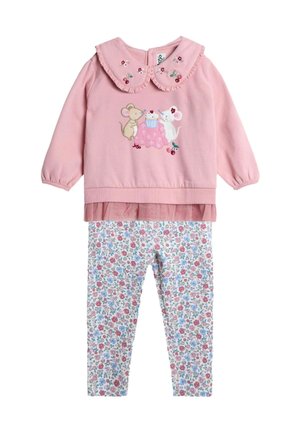 Rosa Langarmoberteil mit Rüschensaum und bestickten Mäusen, kombiniert mit weißen Leggings mit floralem Muster in Rosa und Blau.