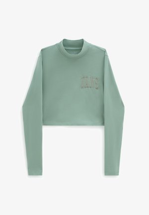 Chemise courte à manches longues en vert menthe clair, en tissu doux, avec un col rond et le logo "VANS" brodé sur le devant.