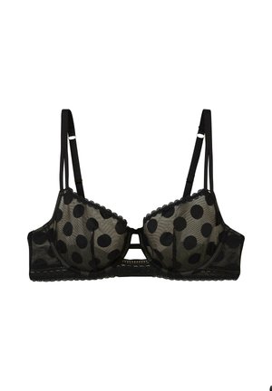 Soutien-gorge en dentelle noire avec de grands pois noirs, bretelles ajustables, bonnets avec armature et bordures festonnées.