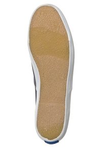 Semelle de chaussure avec une surface en caoutchouc texturé couleur beige, bords blancs et contours lisses. Comprend un petit accent bleu près du talon.