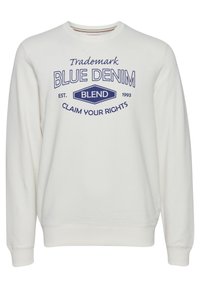 Sudadera de cuello redondo blanca con texto gráfico en color azul marino que dice "Trademark Blue Denim Blend 1993 Claim Your Rights". Tejido suave de algodón.