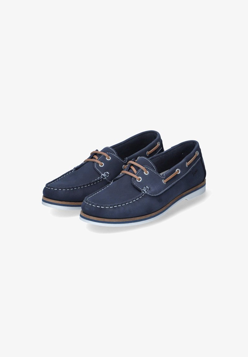 Bateaux en cuir bleu marine avec une tige en cuir, des détails de couture, des lacets marron et une semelle en caoutchouc blanc avec un accent tan.