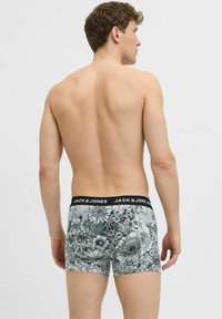 Boxer briefs da uomo con motivo floreale in bianco e nero, tessuto morbido e una cintura elastica nera con marchio bianco.