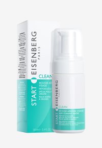 Hvid pumpeflaske med klar hætte, mærket "Start Eisenberg Paris Clean." Akkompagneret af en teal og hvid kasse med produktdetaljer.