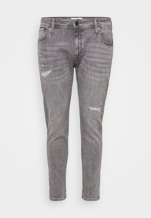 Jeans in denim grigio con dettagli strappati, vestibilità slim, design standard a cinque tasche e gamba leggermente affusolata.