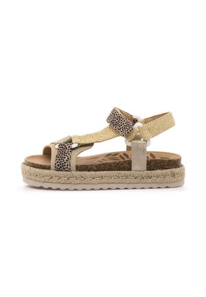 Sandale beige avec brides texturées, accents à motif animalier et semelle intermédiaire en jute tressé. Semelle intérieure rembourrée et bride de cheville réglable.