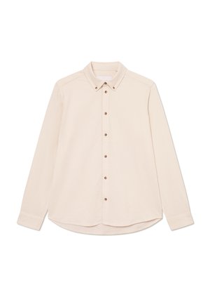 Langermet skjorte i lys beige stoff med krage, frontlukking med brune knapper og rundet hem.