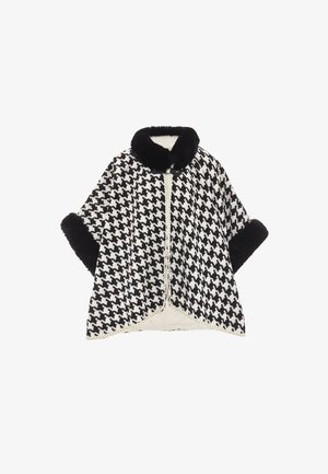 Fekete-fehér houndstooth köpeny puha fekete szőrme gallérral és mandzsettákkal, arany szőtt díszítéssel az élein.