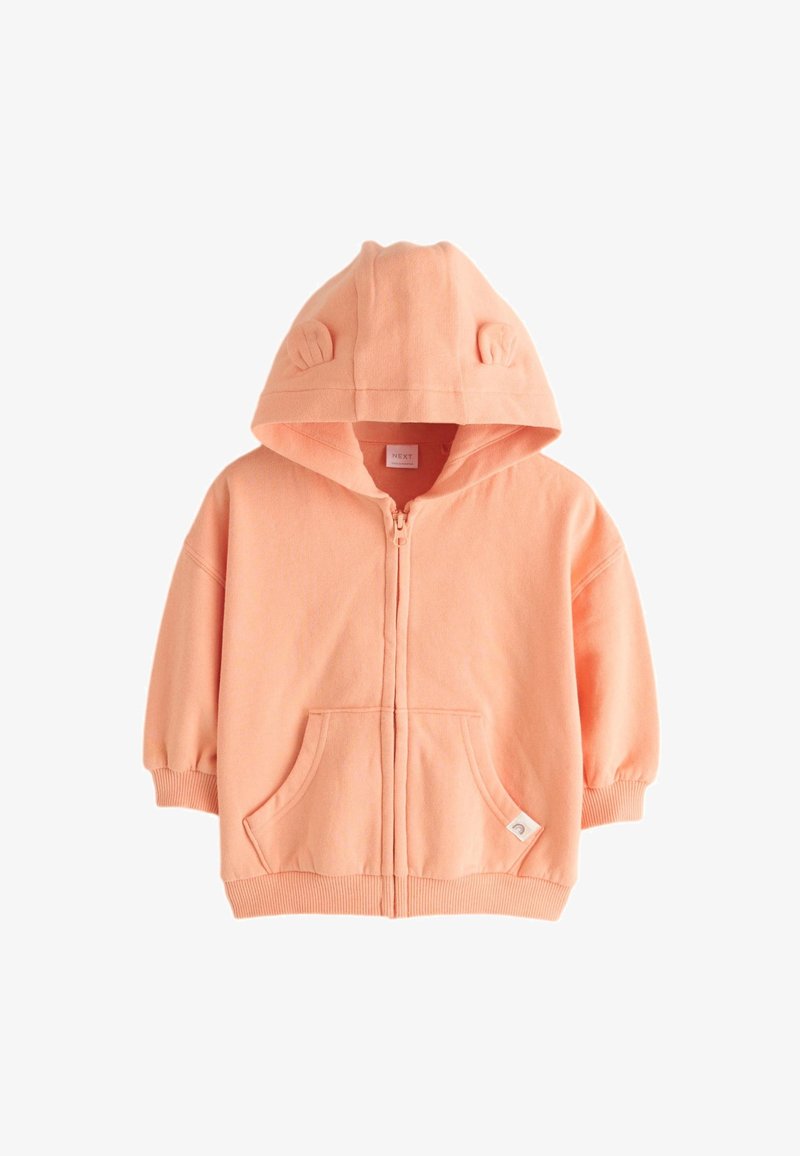 Sweat à capuche zippé pour tout-petit couleur pêche avec poches avant, poignets côtelés et capuche avec petites oreilles en tissu.