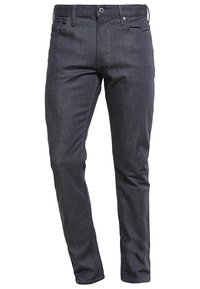 Mörka jeans i slim fit med fem fickor, knapp- och dragkedjestängning samt synliga sömmar på sidorna.