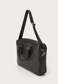 Black leather briefcase with dual handles, adjustable strap, and silver hardware. Smooth texture with a rectangular shape and zip closure.