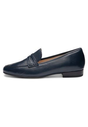 Sort læder slip-on loafer med lav hæl og syninger på overlæderet, vist fra siden på hvid baggrund.