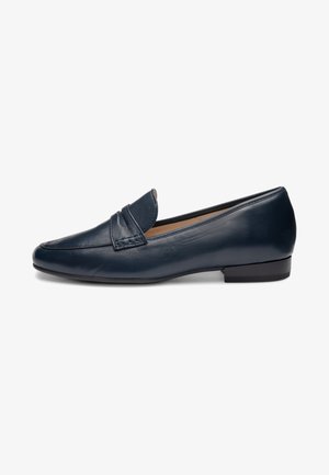 Sort læder slip-on loafer med lav hæl og syninger på overlæderet, vist fra siden på hvid baggrund.