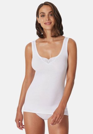 Top in cotone bianco senza maniche con scollatura a girocollo, caratterizzato da un bordo in pizzo con motivo a cuore. Tessuto liscio, design aderente.