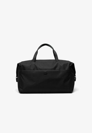 Sac de sport souple noir avec double poignées et une poche frontale zippée, conçu pour les voyages et un usage quotidien.