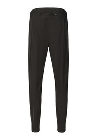 Sorte sportsbukser med elastisk taljebånd og lynlåslomme bagpå, tilspidsede ben med manchetter ved anklerne, vist bagfra.