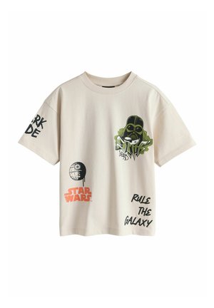 Beež Star Wars T-särk koos Darth Vaderi graafikaga, Surmatähe illustratsioon ning tekst "Star Wars", "Valitse Galaktikat" ja "Pime Pool" varrukatel ja esiküljel.