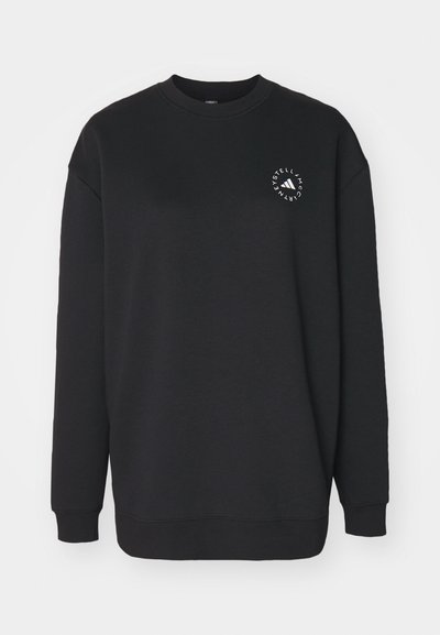 Juodas džemperis, pagamintas iš minkštos medžiagos, su apvaliu kaklu ir ilgomis rankovėmis. Priekyje yra baltos spalvos logotipo dizainas.