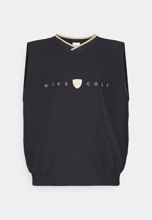 Svart ermeløs Nike Golf topp med V-hals, med gulllogo og trim. Glatt tekstur og elastisk bunnkant.