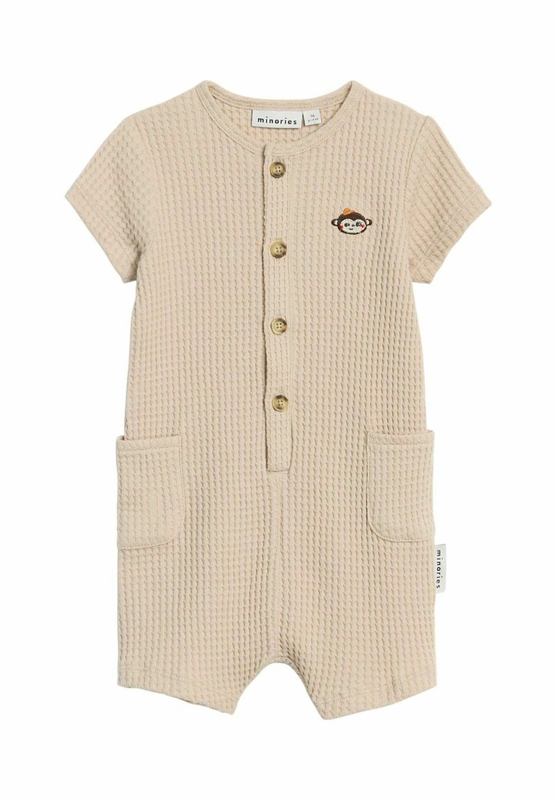 Beige short-sleeve romper met een gestructureerd wafelpatroon, voorzien van een knoopsluiting aan de voorkant, twee zakken en een kleine geborduurde aapdetail.