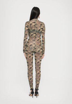 Uvrstitev 14: Norma Kamali - LONG SLEEVE CATSUIT - Pajac