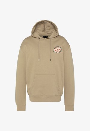 Felpa beige con cappuccio, tasca frontale, coulisse sul cappuccio e un logo circolare rosso e bianco sul petto a sinistra. Tessuto morbido al tatto.