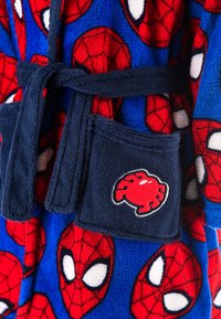 Blue plush robe featuring a red spider web pattern and white spider eyes, with a navy belt and pocket displaying a red spider logo.