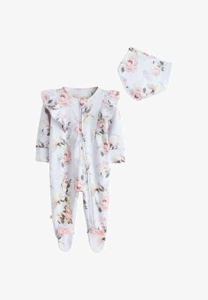 Ilgas rankovėmis kūdikio romperis su gėlių raštu, raukiniais ant pečių ir rožiniais kaspinėliais, derinamas su atitinkančia gėlių raštu seilinuke.