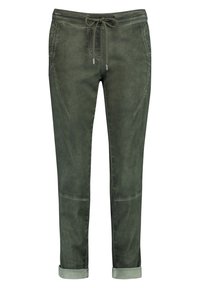 Ciemnozielone bawełniane joggery z elastycznym pasem na sznurki, ściągaczami na końcach nogawek i kieszeniami bocznymi, o gładkiej teksturze i prostym designie.