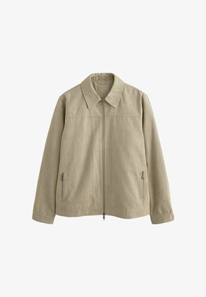 Giacca beige chiaro con colletto, chiusura anteriore con zip e due tasche laterali con zip. Realizzata in un tessuto morbido e testurizzato.