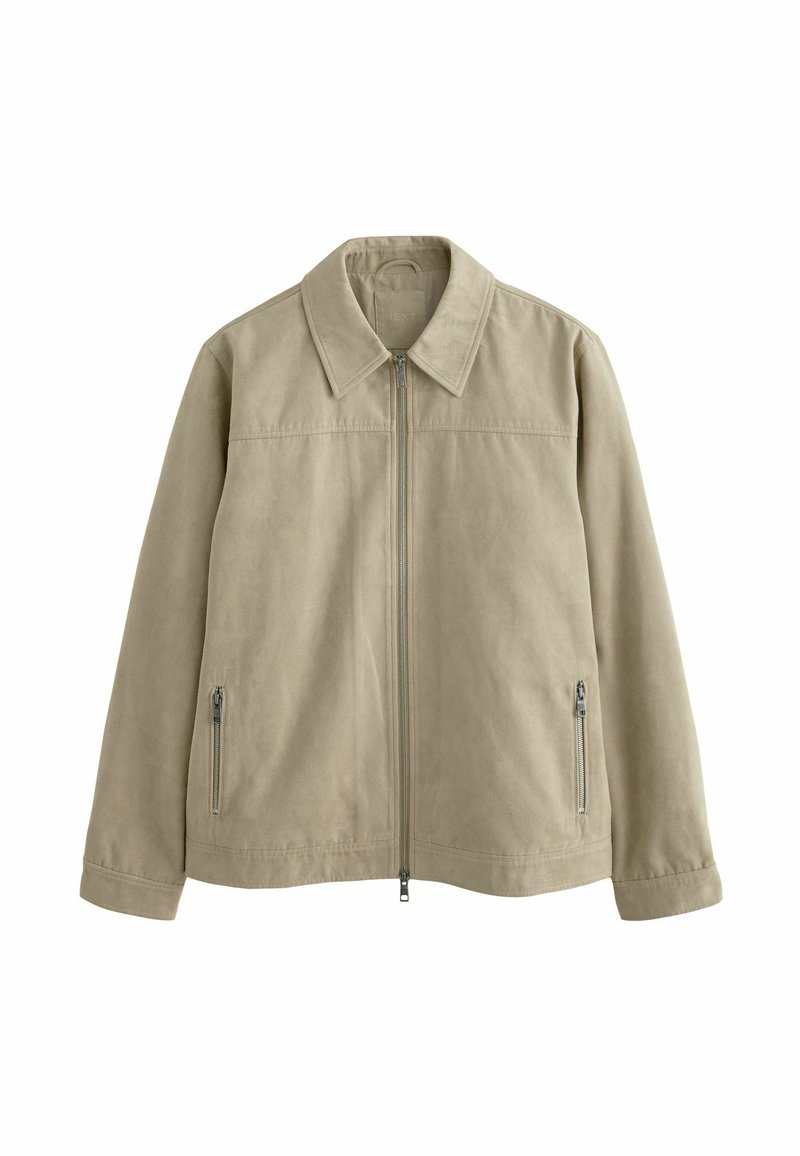 Chaqueta ligera beige con cremallera frontal, cuello de camisa y dos cremalleras laterales. Textura suave y diseño sencillo, adecuada para ropa casual.