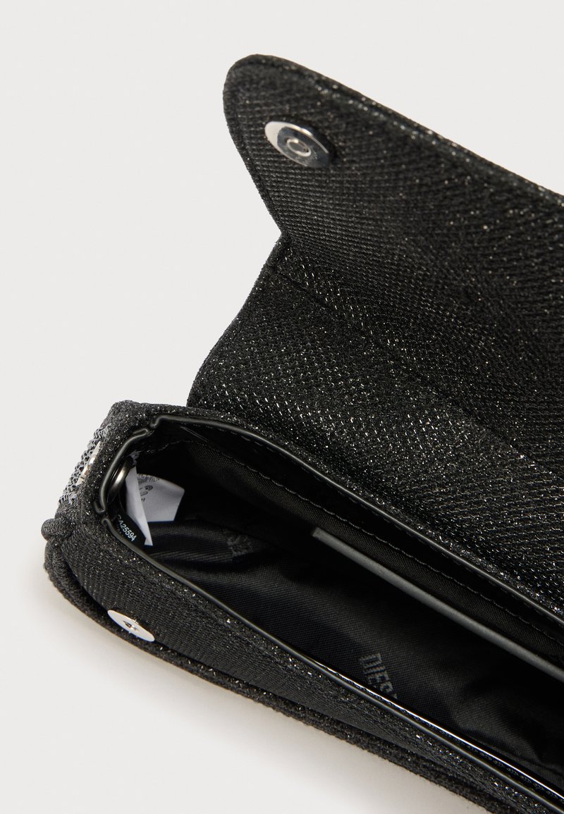 Black fabric wallet with a textured surface, featuring a snap closure and an interior lining, including a card slot and pen holder.