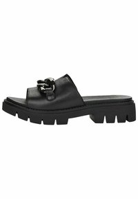 Black leather slide-on sandals featuring a wide strap and a decorative chain accent, with a chunky textured sole for grip.