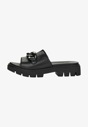 Black leather slide-on sandals featuring a wide strap and a decorative chain accent, with a chunky textured sole for grip.