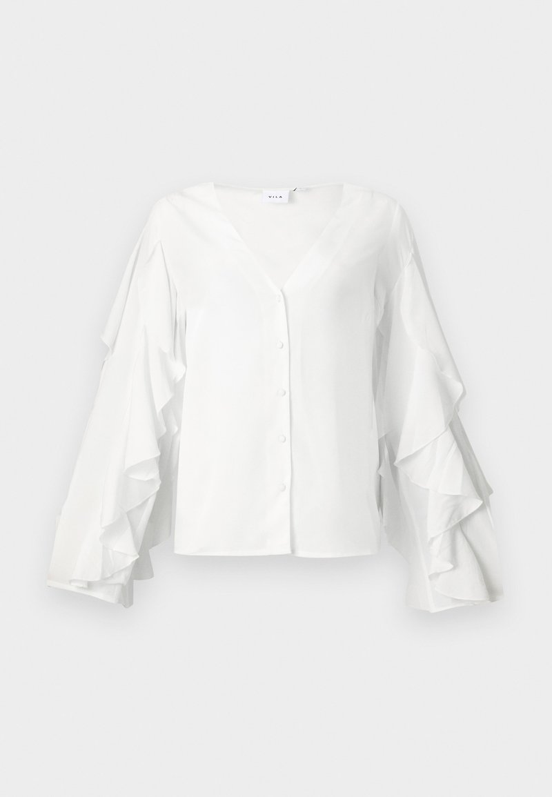 Blouse blanche à décolleté en V, fermetures à boutons et manches volumineuses à volants. Fabriquée en tissu lisse avec un design épuré et minimaliste.
