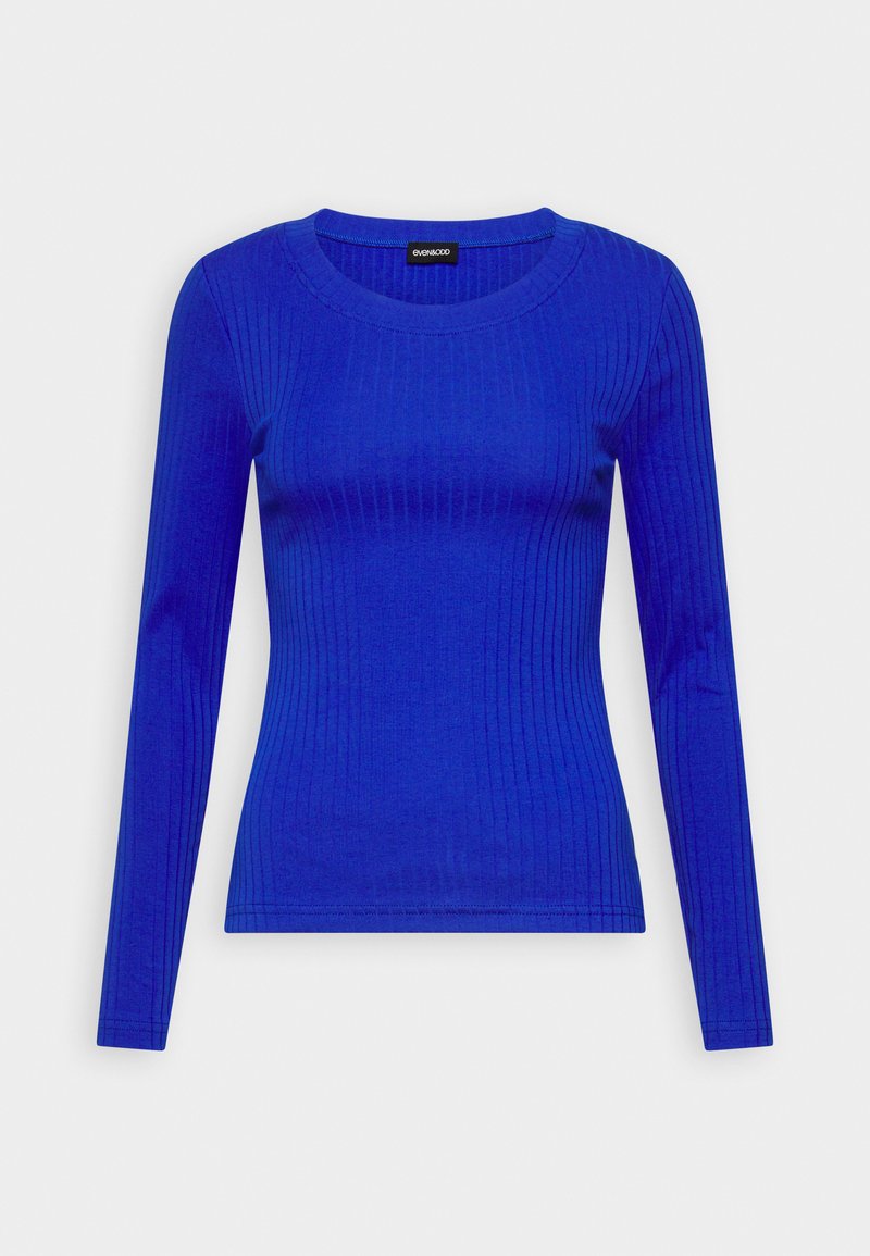 Ribbed dugo rukavni top u svijetlo plavoj boji. Ima okrugli izrez i priljubljenu siluetu, izrađen od glatkog, rastezljivog materijala.