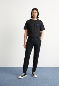 adidas Originals Träningsbyxor - black