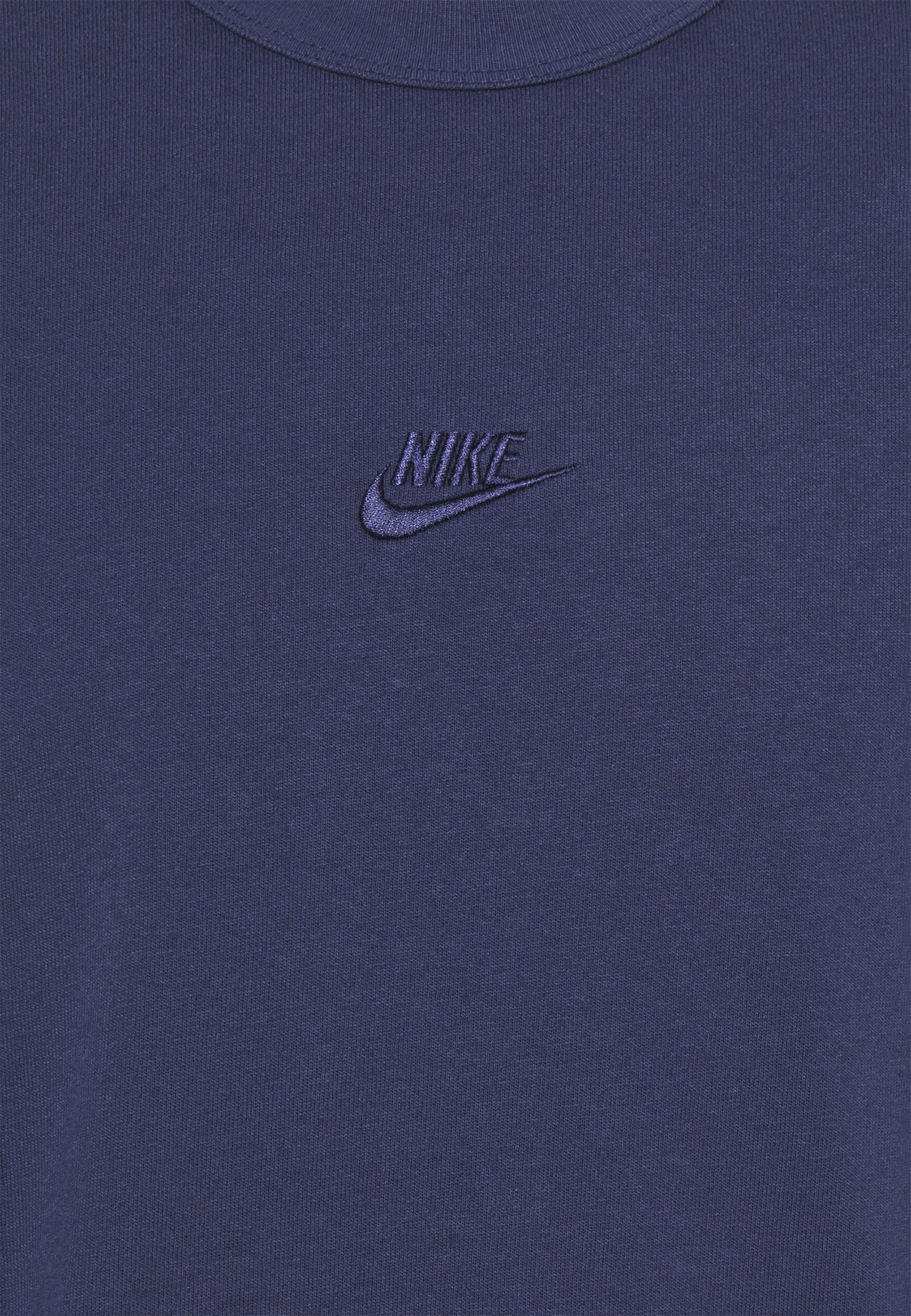 navy blue and white nike shirt