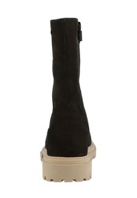 Black suede ankle boot with a side zipper, featuring a contrasting beige rubber sole and a textured finish.
