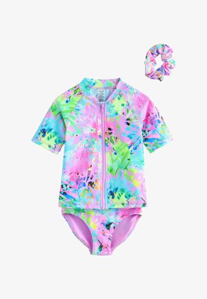 Kortærmet, lynlås badetop i levende pink, blå, grønne og lilla abstrakte mønstre med matchende bikini underdel og scrunchie tilbehør.