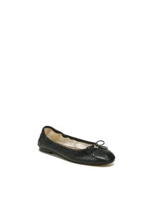 Black leather ballet flat with a round toe, a small bow at the front, and a soft beige interior. Features minimal hardware accents on the side.