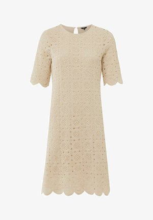 Blonde kjole i neutral beige med rund hals og korte ærmer. Har en scallop-kant og cirkulært mønster hele vejen igennem. Lukning med nøglehul i ryggen.