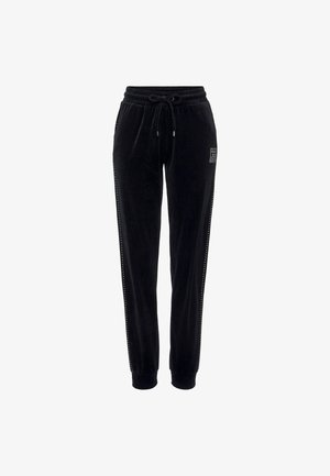 Zwarte velours joggers met een elastische tailleband en een trekkoord, met zijaccenten van kleine uitsparingen en een logo-opdruk aan de voorkant.
