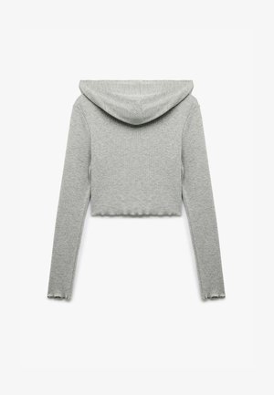 Grå cropped hoodie lavet af blødt stof med hætte, lange ærmer og en bølget kant. Simpelt, minimalistisk design uden yderligere grafik.