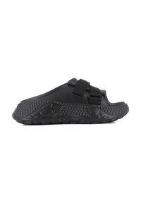 Black open-toed sandal with a textured rubber sole, adjustable straps, and a smooth upper surface. Features a contoured shape for comfort.